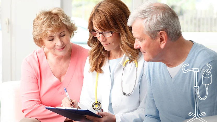 a doctor talking to a man and a woman