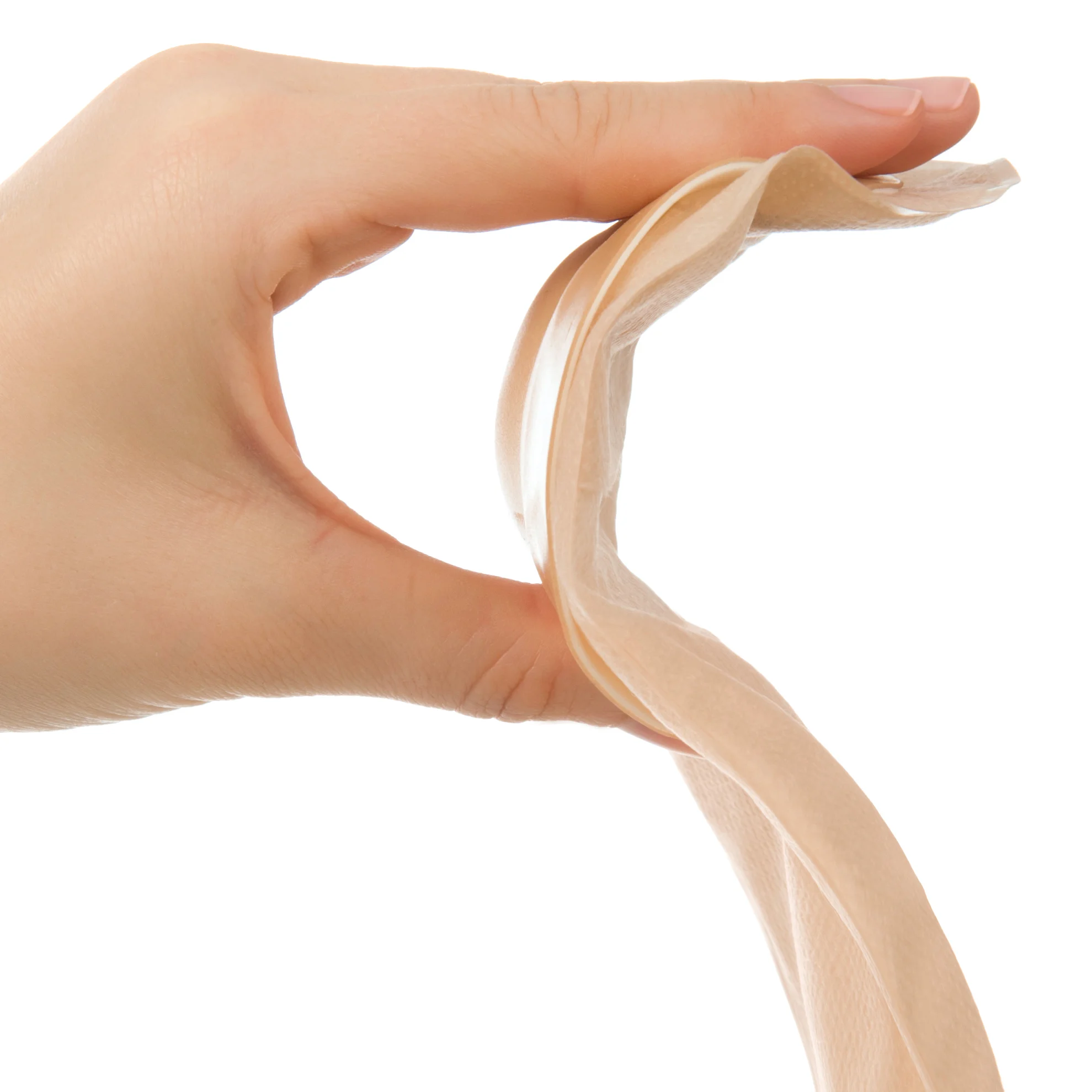 a close-up of a hand holding a skin barrier